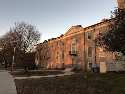 The setting sun makes Knowlton House glow in orange light