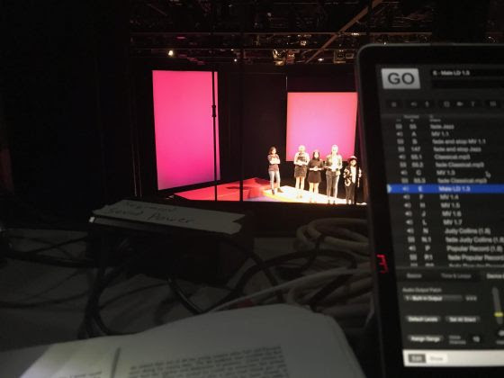 Sound design station overlooking the stage and cast of Uncommon Women and Others