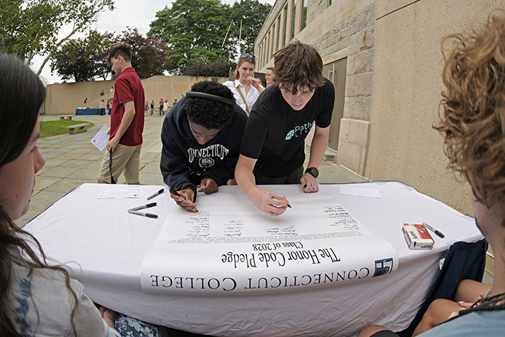 New students sign the honor code pledge.