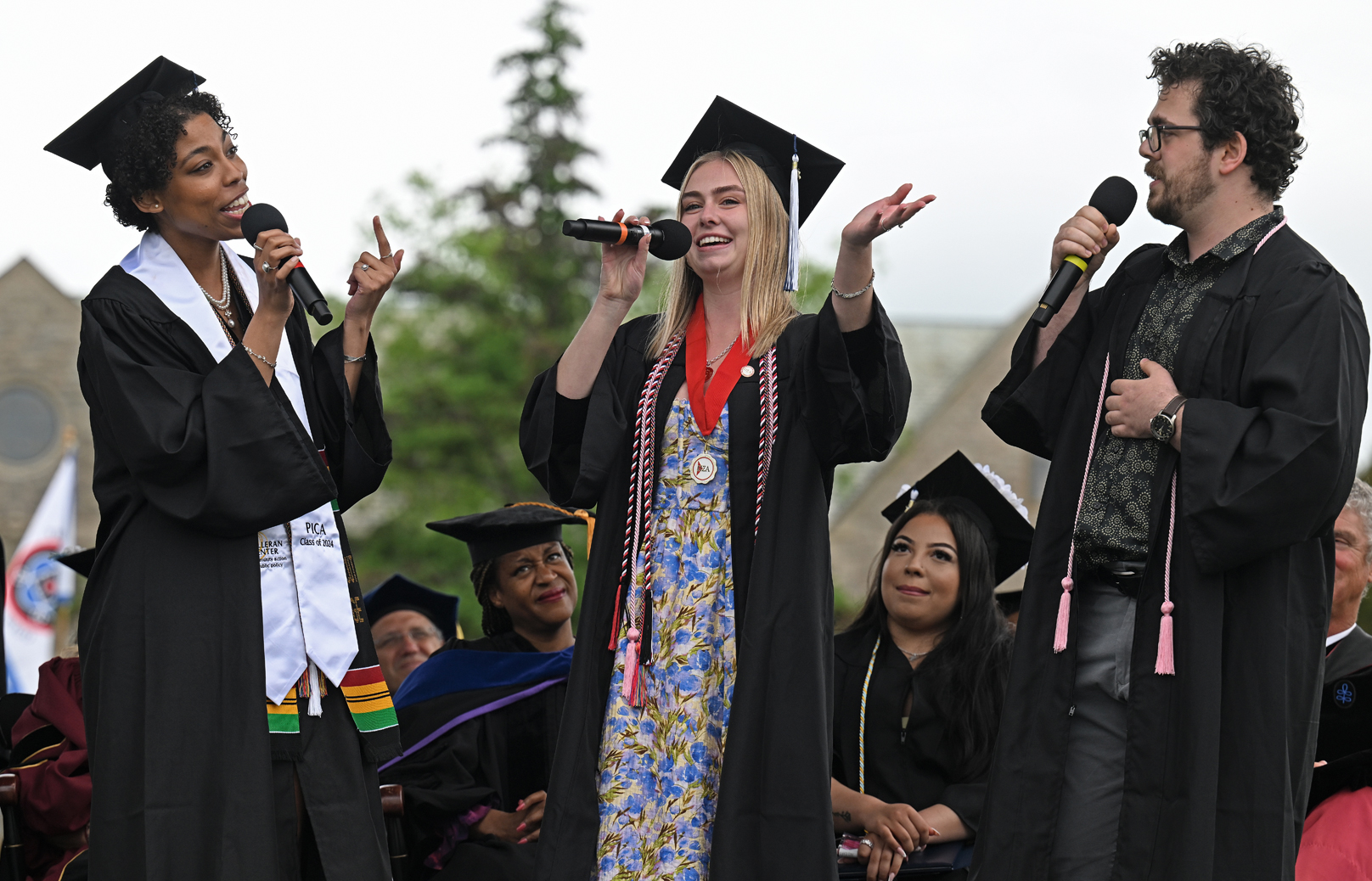 Graduates sing the alma mater