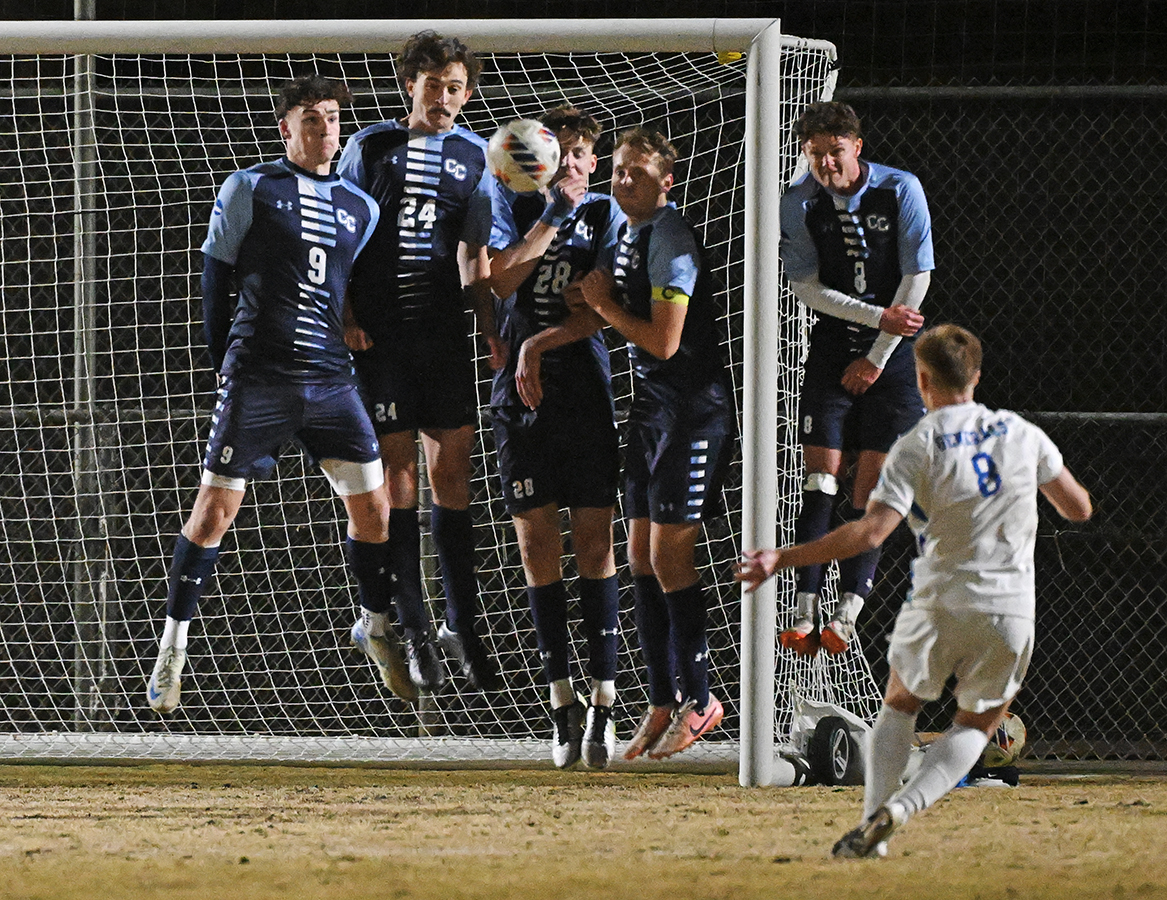 Conn players successfully deflect a Washington and Lee free kick.